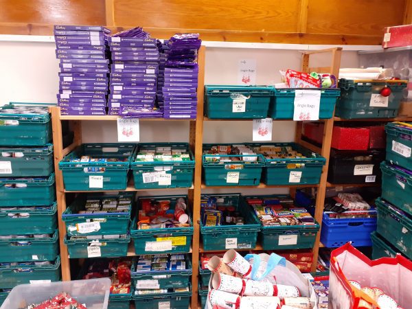 The shelves at East Lothian Foodbank packed with Christmas goodies.
